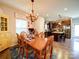 Cozy dining room area features a wooden table, a chandelier, and view of the kitchen at 1232 Scotch Meadows Loop, Monroe, NC 28110