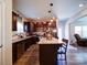 Stylish kitchen featuring an island, stainless steel appliances, granite countertops, and a view into the adjacent living space at 1232 Scotch Meadows Loop, Monroe, NC 28110