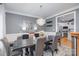 Dining room with modern chandelier, stylish table, and neutral color palette at 12441 Morning Creek Ln, Charlotte, NC 28214