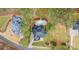 An aerial view of a home with private pool and well manicured lawns at 133 Crooked Branch Way, Troutman, NC 28166