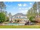 A spacious backyard featuring a pool, hot tub, and lush greenery at 133 Crooked Branch Way, Troutman, NC 28166