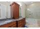 Bathroom featuring double vanities with granite countertops and a tiled shower and tub combo at 133 Crooked Branch Way, Troutman, NC 28166