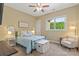 Comfortable bedroom with a large window, neutral colors, and cozy furnishings at 133 Crooked Branch Way, Troutman, NC 28166