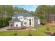 Stunning two-story home with lush landscaping, stone accents, and a grand entryway at 133 Crooked Branch Way, Troutman, NC 28166