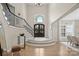 Elegant foyer with a grand staircase and high ceilings, creating a welcoming entrance at 133 Crooked Branch Way, Troutman, NC 28166