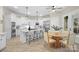 Modern kitchen with a center island, stainless steel appliances, and ample cabinet space at 133 Crooked Branch Way, Troutman, NC 28166