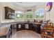 Charming kitchenette featuring granite countertops and sleek stainless steel appliances at 133 Crooked Branch Way, Troutman, NC 28166