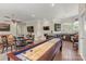 Open-concept living room with a kitchenette and entertainment area, perfect for gatherings at 133 Crooked Branch Way, Troutman, NC 28166