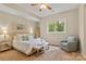 Serene main bedroom with natural light, plush carpeting, and stylish decor at 133 Crooked Branch Way, Troutman, NC 28166