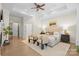 Luxurious main bedroom featuring a tray ceiling, with hardwood flooring and a cozy sitting area at 133 Crooked Branch Way, Troutman, NC 28166