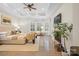 Bright and airy main bedroom featuring a fireplace, bay window, and hardwood floors at 133 Crooked Branch Way, Troutman, NC 28166