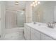 Well-lit bathroom with double vanity, tile floors, and shower-tub combo at 140 Melbourne Dr, Fort Mill, SC 29708