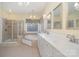 Bright bathroom with double vanity, soaking tub, separate shower, and elegant fixtures at 140 Melbourne Dr, Fort Mill, SC 29708