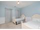 Light and airy bedroom with two twin beds and soothing blue walls at 140 Melbourne Dr, Fort Mill, SC 29708