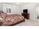 Comfortable bedroom with a large bed, dresser, and an ensuite bathroom at 140 Melbourne Dr, Fort Mill, SC 29708