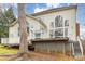 The home has a spacious deck and large windows that bring in natural light at 140 Melbourne Dr, Fort Mill, SC 29708