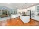 Modern kitchen with white cabinets, granite countertops, stainless steel appliances, and center island at 140 Melbourne Dr, Fort Mill, SC 29708