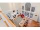 Bright living room with high ceilings, large windows, built-in bookshelves, and a cozy fireplace at 140 Melbourne Dr, Fort Mill, SC 29708
