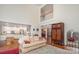 Spacious living room with hardwood flooring, staircase, and views into the kitchen at 140 Melbourne Dr, Fort Mill, SC 29708
