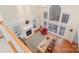 Bright living room with high ceilings, large windows, built-in bookshelves, and a cozy fireplace at 140 Melbourne Dr, Fort Mill, SC 29708