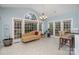 Cozy sunroom with tile flooring, large windows, and comfortable seating, perfect for relaxation at 140 Melbourne Dr, Fort Mill, SC 29708