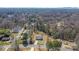 An aerial view of a home surrounded by lush greenery and a quiet neighborhood at 1507 W Davidson Ave, Gastonia, NC 28052