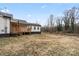 Wide backyard offering a serene outdoor space behind the home at 1507 W Davidson Ave, Gastonia, NC 28052