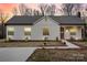 Inviting home exterior with neatly trimmed bushes and a welcoming front porch at 1507 W Davidson Ave, Gastonia, NC 28052