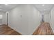 Neutral hallway showcasing modern wood-look flooring and recessed lighting at 1507 W Davidson Ave, Gastonia, NC 28052
