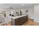 Modern kitchen with a breakfast bar, stylish cabinets, and a view of the living room at 1507 W Davidson Ave, Gastonia, NC 28052
