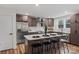 Modern kitchen with stainless steel appliances, white countertops, and a breakfast bar at 1507 W Davidson Ave, Gastonia, NC 28052