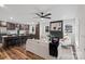 Open concept living room featuring stylish furniture, a brick fireplace, and a view of the modern kitchen at 1507 W Davidson Ave, Gastonia, NC 28052