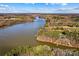 Aerial view of lakefront property showcasing the expansive waterfront and wooded surroundings at 1547 Sunset Pointe Dr, Salisbury, NC 28146