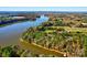 Aerial view of lakefront property showcasing the expansive waterfront and wooded surroundings at 1547 Sunset Pointe Dr, Salisbury, NC 28146