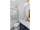 Elegant bathroom showcasing a marble vanity, gold fixtures, and a tiled shower with glass door at 1547 Sunset Pointe Dr, Salisbury, NC 28146