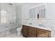 Bathroom with dual sinks, marble countertops, and walk-in shower at 1547 Sunset Pointe Dr, Salisbury, NC 28146