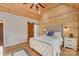 Well-lit bedroom with vaulted ceiling, stylish decor, and wood accent walls at 1547 Sunset Pointe Dr, Salisbury, NC 28146
