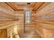 Walk-in closet features hardwood floors and walls as well as built-in shelves at 1547 Sunset Pointe Dr, Salisbury, NC 28146