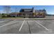 Community clubhouse with a covered porch, offering a welcoming space for gatherings and events at 1547 Sunset Pointe Dr, Salisbury, NC 28146