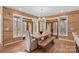 Bright dining room with wood table, bench seating and exterior wood paneled walls at 1547 Sunset Pointe Dr, Salisbury, NC 28146