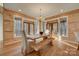 Bright dining room with wood walls and an inviting wood table at 1547 Sunset Pointe Dr, Salisbury, NC 28146