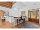 Beautiful foyer with wood floors, wood door, transom window and white walls at 1547 Sunset Pointe Dr, Salisbury, NC 28146