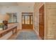 Inviting foyer with wood accents, a stylish console table, and a clear view of the door at 1547 Sunset Pointe Dr, Salisbury, NC 28146