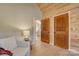 Hallway featuring natural wood accents, soft lighting, and access to multiple rooms at 1547 Sunset Pointe Dr, Salisbury, NC 28146