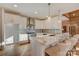 Bright kitchen featuring marble counters, stainless appliances, and pendant lighting over the island at 1547 Sunset Pointe Dr, Salisbury, NC 28146