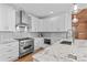 Gourmet kitchen features stainless steel appliances, custom cabinets, marble countertops and backsplash at 1547 Sunset Pointe Dr, Salisbury, NC 28146