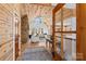 Bright, open living room with vaulted wood ceilings, stone fireplace, and large windows offering natural light at 1547 Sunset Pointe Dr, Salisbury, NC 28146