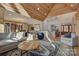 Open-concept living room with abundant light and wood accents at 1547 Sunset Pointe Dr, Salisbury, NC 28146