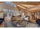 Spacious living room featuring a wood ceiling, many windows, and hardwood flooring at 1547 Sunset Pointe Dr, Salisbury, NC 28146