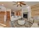 Open living room boasts a stone fireplace, comfortable seating, and seamless flow at 1547 Sunset Pointe Dr, Salisbury, NC 28146